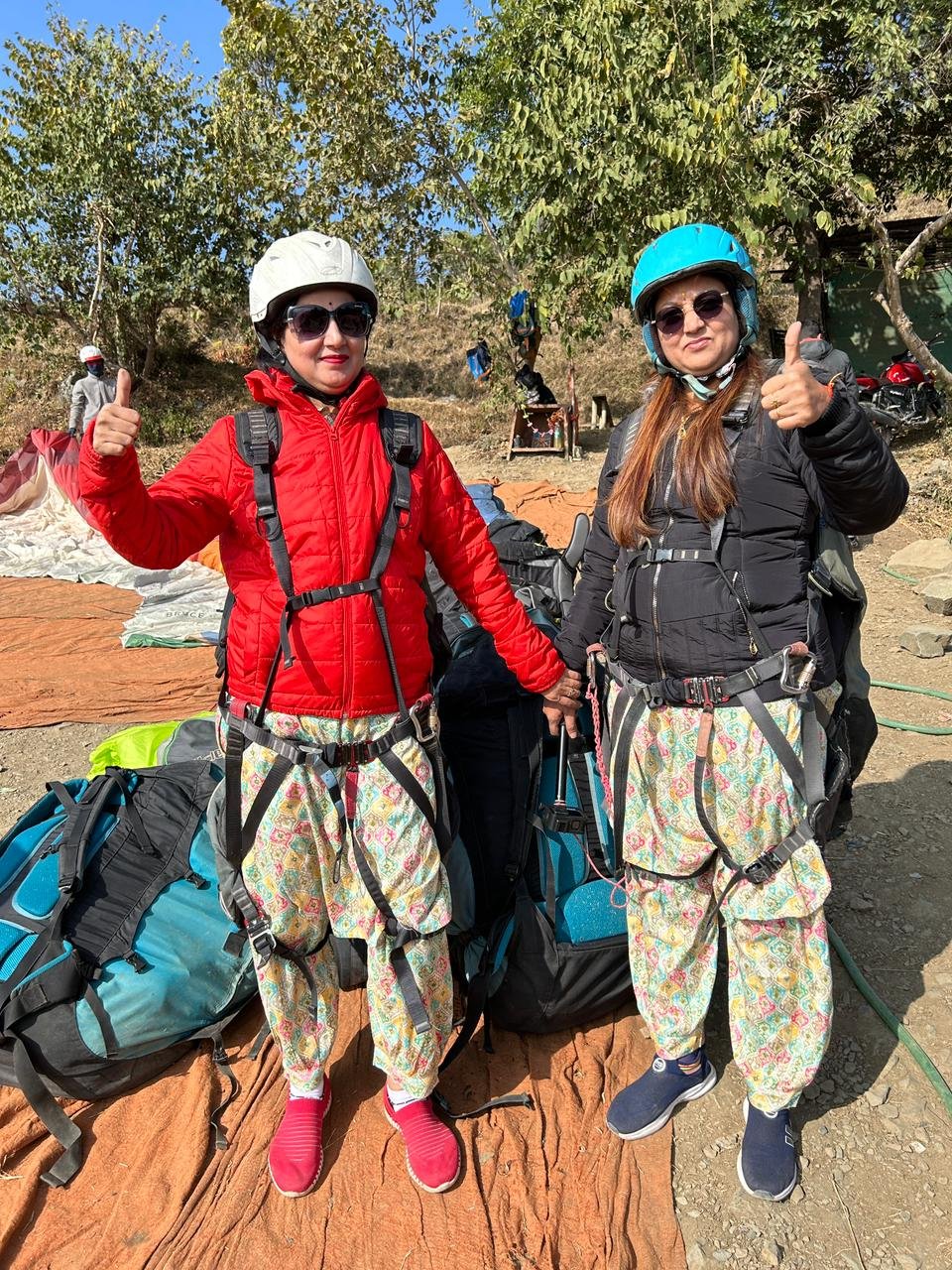 Two travelers ready for paragliding adventure