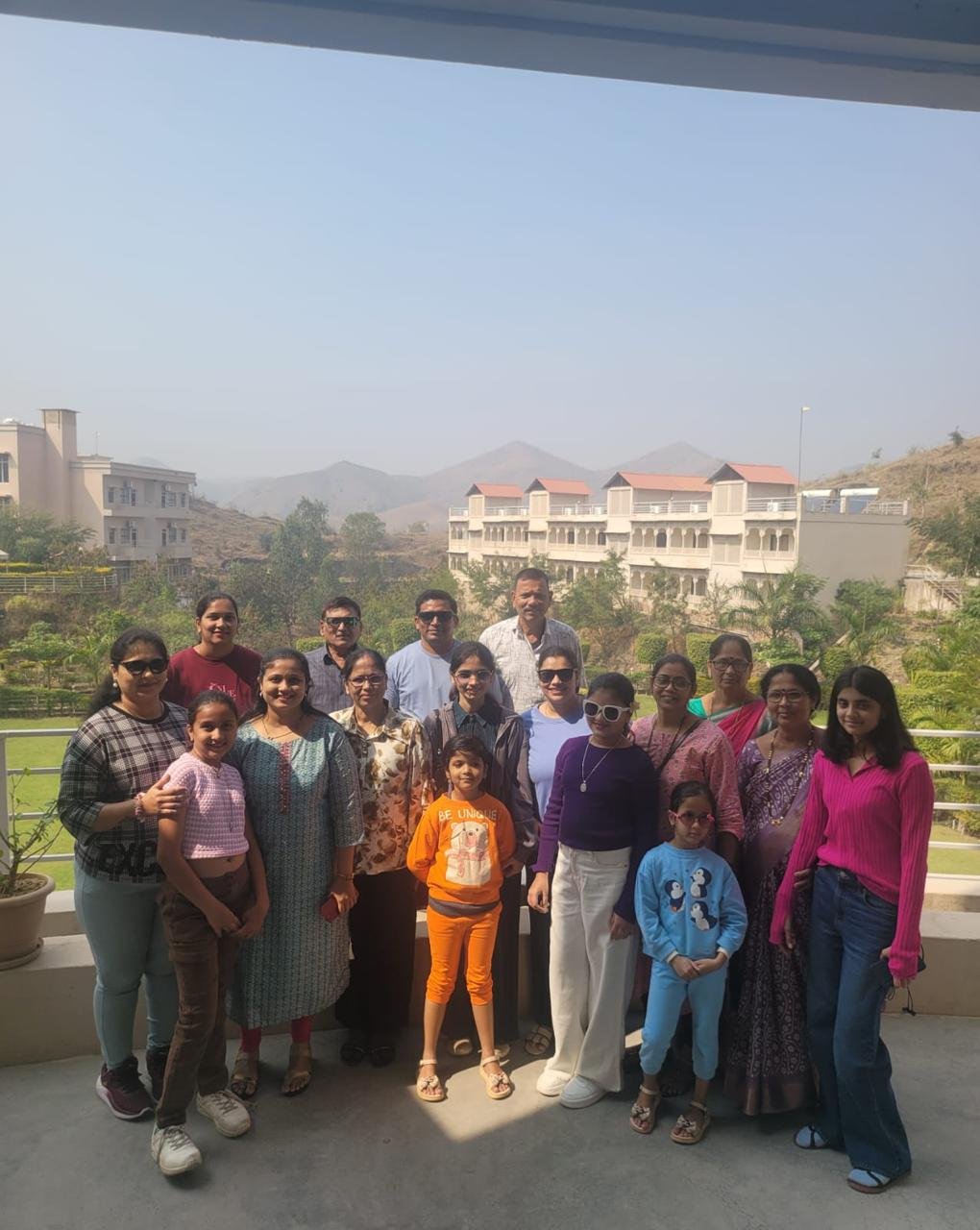Family group photo with mountain resort view